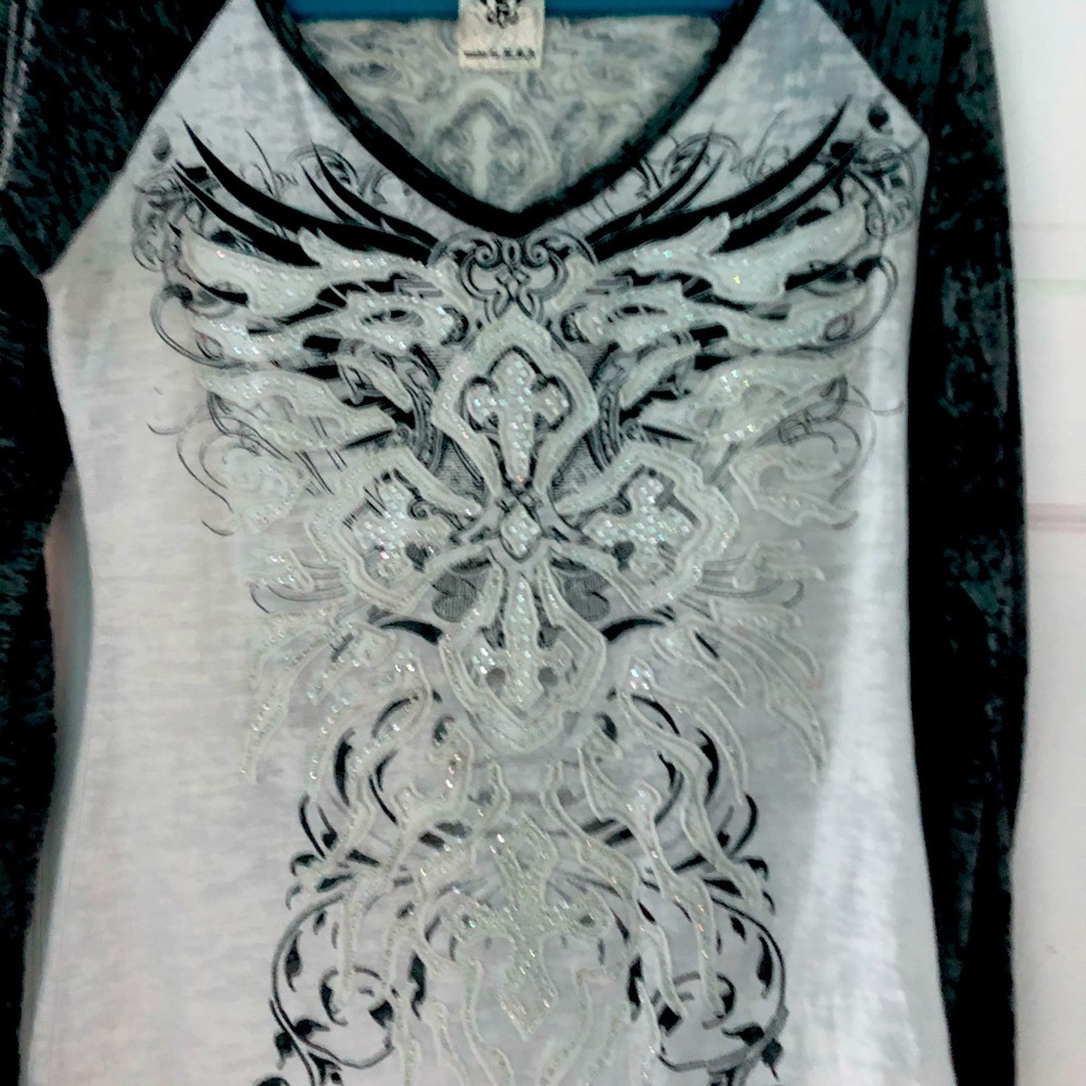 Washed out shirt with embellishments. Long sleeve.